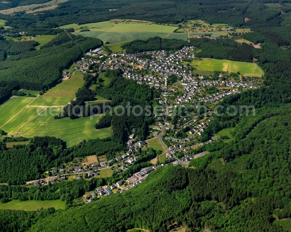 Kirschweiler from the bird's eye view: View of Kirschweiler in the state of Rhineland-Palatinate. The borough and municipiality is an official tourist resort and located in the county district of Birkenfeld, in the Hunsrueck region. It is surrounded by agricultural land, meadows and forest and consists of several hamlets and residential areas