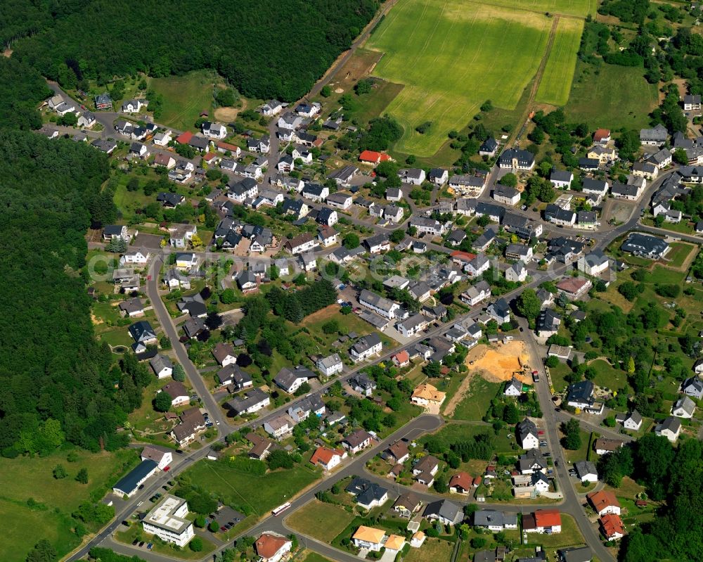 Kirschweiler from the bird's eye view: View of Kirschweiler in the state of Rhineland-Palatinate. The borough and municipiality is an official tourist resort and located in the county district of Birkenfeld, in the Hunsrueck region. It is surrounded by agricultural land, meadows and forest and consists of several hamlets and residential areas