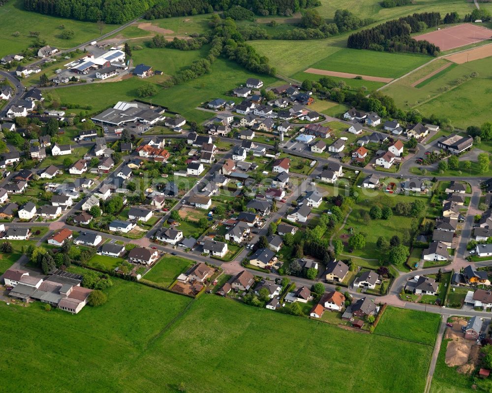 Aerial image Kölbingen - View of Koelbingen in the state of Rhineland-Palatinate. The borough and municipiality Koelbingen is located in the county district of Westerwaldkreis and is a rural residential borough. Koelbingen is surrounded by agricultural land, hills and meadows and located in a valley between Geisenwald forest and Ruhscheid. It consists of three parts