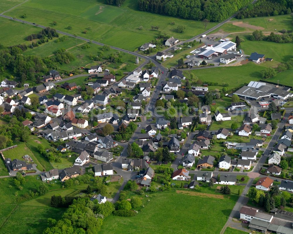 Aerial photograph Kölbingen - View of Koelbingen in the state of Rhineland-Palatinate. The borough and municipiality Koelbingen is located in the county district of Westerwaldkreis and is a rural residential borough. Koelbingen is surrounded by agricultural land, hills and meadows and located in a valley between Geisenwald forest and Ruhscheid. It consists of three parts