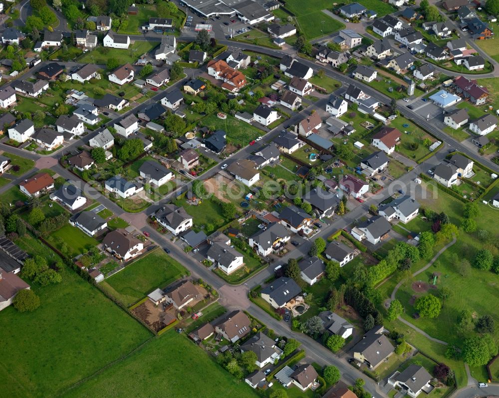 Kölbingen from above - View of Koelbingen in the state of Rhineland-Palatinate. The borough and municipiality Koelbingen is located in the county district of Westerwaldkreis and is a rural residential borough. Koelbingen is surrounded by agricultural land, hills and meadows and located in a valley between Geisenwald forest and Ruhscheid. It consists of three parts