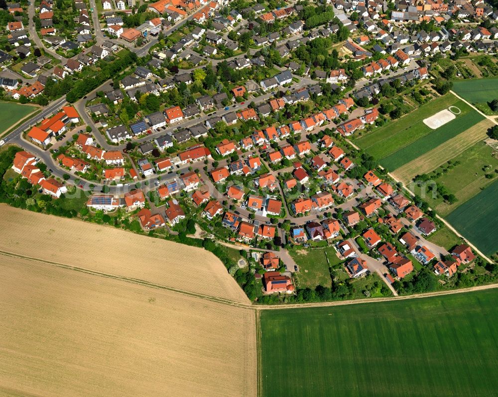 Klein-Winternheim from the bird's eye view: View of the borough of Klein-Winternheim in the state of Rhineland-Palatinate. The wine-growing borough is located in the county district of Mainz-Bingen, on federal motorway A63. The residential village is surrounded by fields, vineyards and meadows