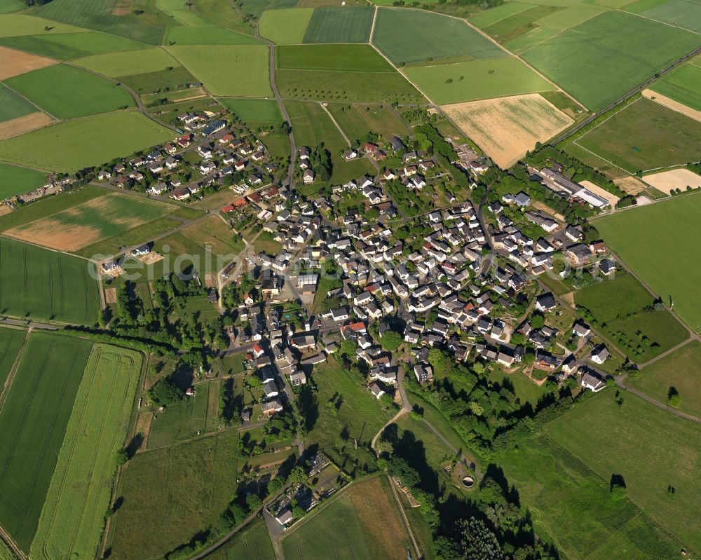 Aerial image Kördorf - View of the borough of Koerdorf in the state of Rhineland-Palatinate. The borough and municipiality is located in the county district of Rhine-Lahn. The agricultural village consists of residential buiildings and areas, sits in the Western Taunus mountain range and is surrounded by meadows and fields