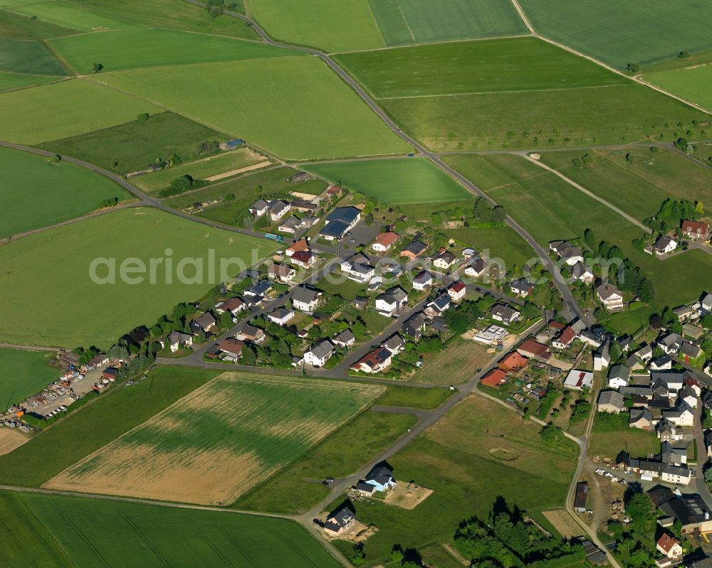 Kördorf from above - View of the borough of Koerdorf in the state of Rhineland-Palatinate. The borough and municipiality is located in the county district of Rhine-Lahn. The agricultural village consists of residential buiildings and areas, sits in the Western Taunus mountain range and is surrounded by meadows and fields