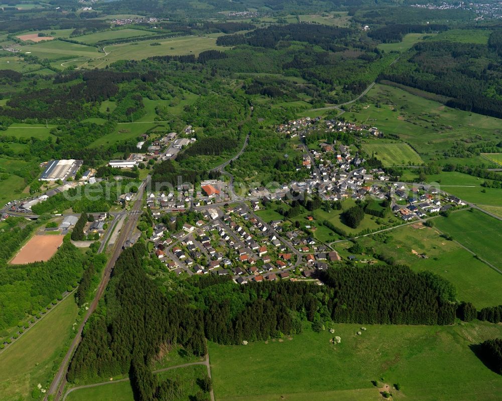 Langenhahn from the bird's eye view: View of the borough of Langenhahn in the state of Rhineland-Palatinate. The borough is located in the county district and region of Westerwald. The residential village is surrounded by fields and meadows. It is located on federal highway B255