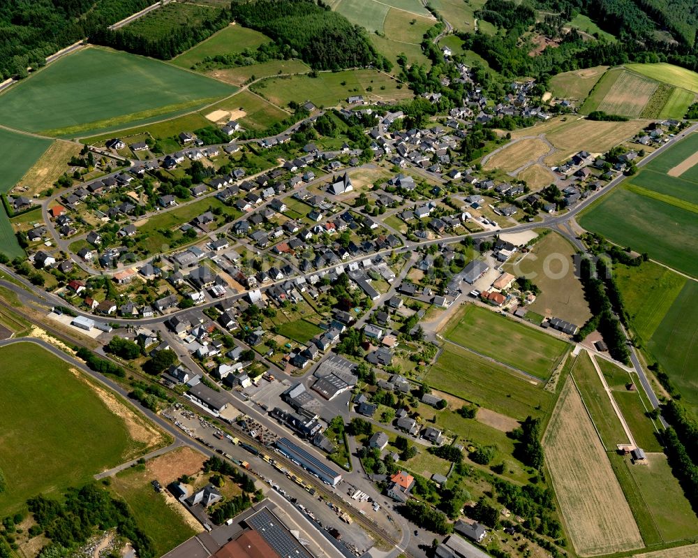 Laubach from above - View of Laubach in the state of Rhineland-Palatinate. The borough and municipiality is located in the county district of Cochem-Zell in the Eifel region. The official tourist resort is surrounded by agricultural land, meadows and forest