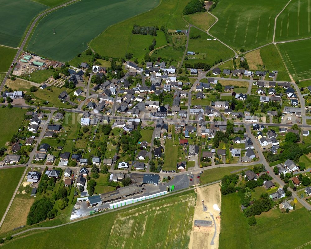 Lingerhahn from the bird's eye view: View of the borough of Lingerhahn in the state of Rhineland-Palatinate. The borough and municipiality is located in the county district of Rhine-Hunsrueck, in the Hunsrueck region. The official spa resort consists of residential areas and is surrounded by fields and meadows