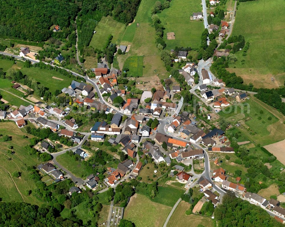 Löllbach from above - View of Loellbach in the state of Rhineland-Palatinate. Loellbach is a borough and municipiality in the county district of Bad Kreuznach, in the region of the Northern Palatinate mountain region. The village is surrounded by hills, fields and vineyards