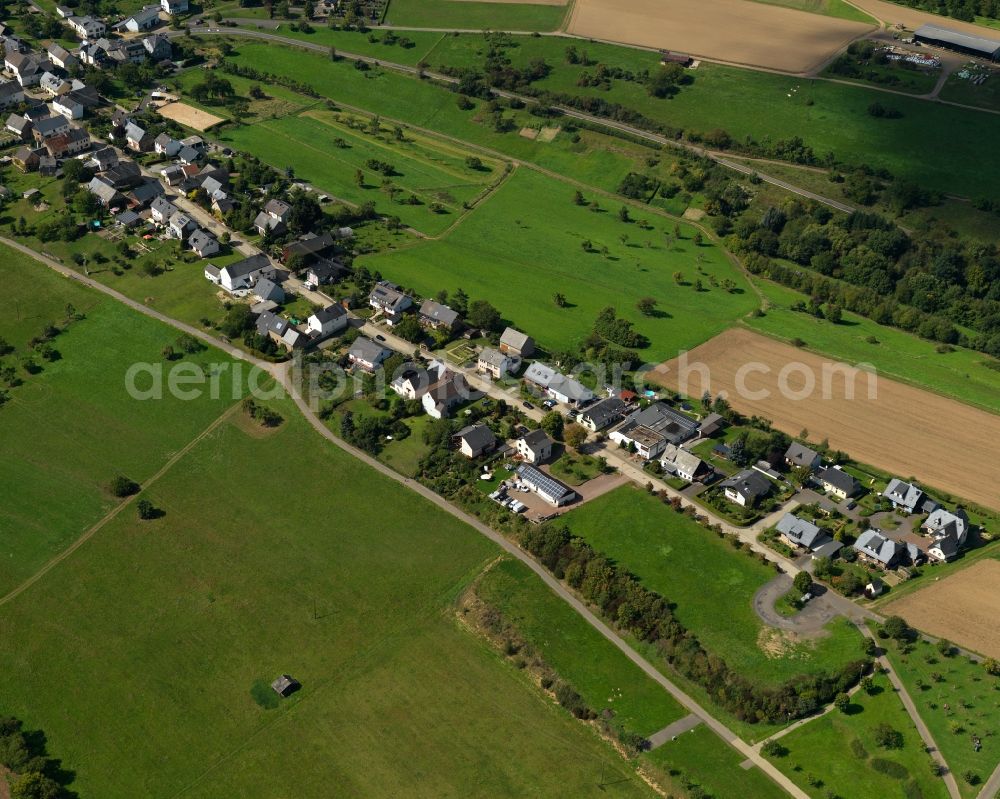 Macken from above - View of Macken in the state of Rhineland-Palatinate. The borough and municipiality of Macken is located in the county district of Mayen-Koblenz in the Moselle hills in the Hunsrueck region. Macken is surrounded by agricultural land and meadows. A large part of the municipial area is covered in woods and forest