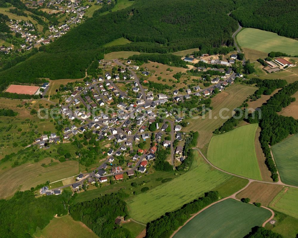 Mackenrodt from above - View of Mackenrodt in the state of Rhineland-Palatinate. The borough and municipiality is located in the county district of Birkenfeld, in the Hunsrueck region. It is surrounded by agricultural land, meadows and forest and consists of residential areas