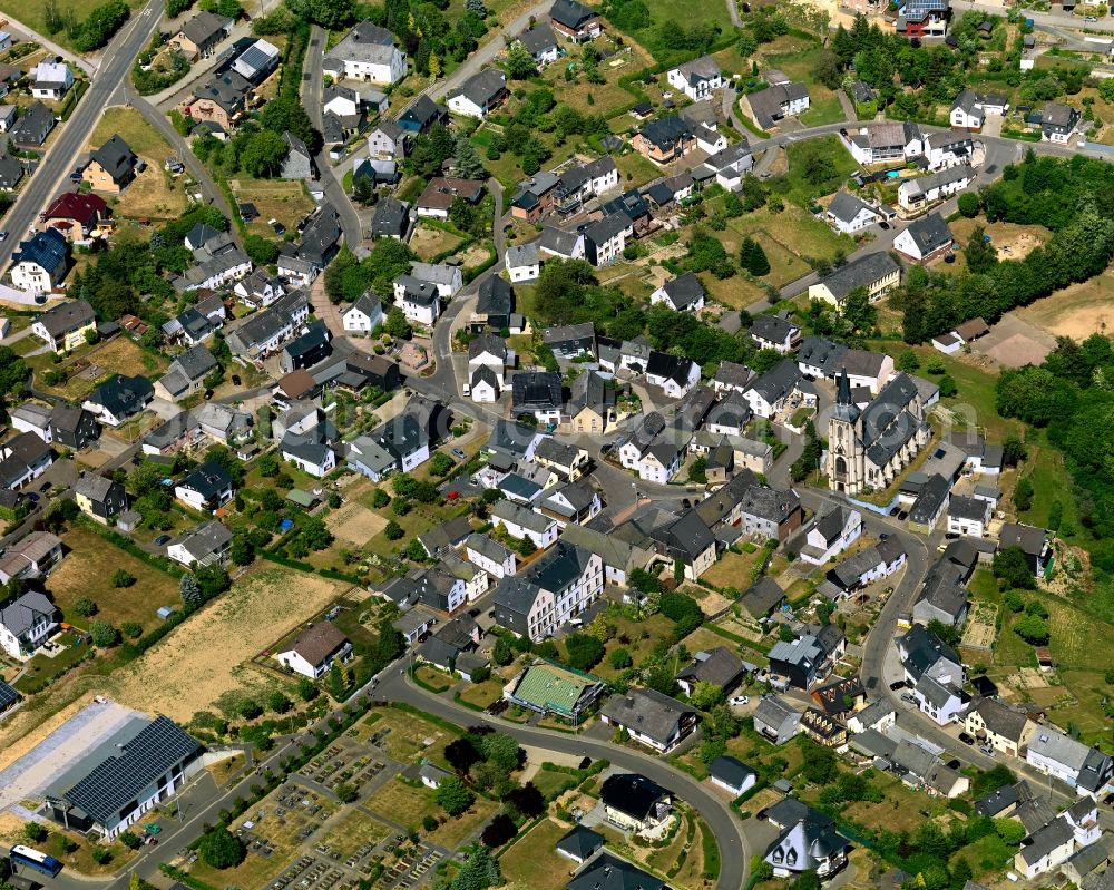 Aerial image Müllenbach - View of Muellenbach in the state of Rhineland-Palatinate. The borough and municipiality is located in the county district of Cochem-Zell in the Eifel region. It is surrounded by agricultural land, meadows and forest