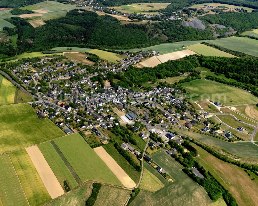 Aerial photograph Müllenbach - View of Muellenbach in the state of Rhineland-Palatinate. The borough and municipiality is located in the county district of Cochem-Zell in the Eifel region. It is surrounded by agricultural land, meadows and forest