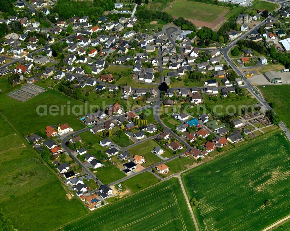 Aerial image Moschheim - View of Moschheim in the state of Rhineland-Palatinate. The borough and municipiality is located in the county district of Westerwaldkreis in the low mountain range of Westerwald - the so called Kannenbaeckerland. Moschheim is surrounded by agricultural land and meadows