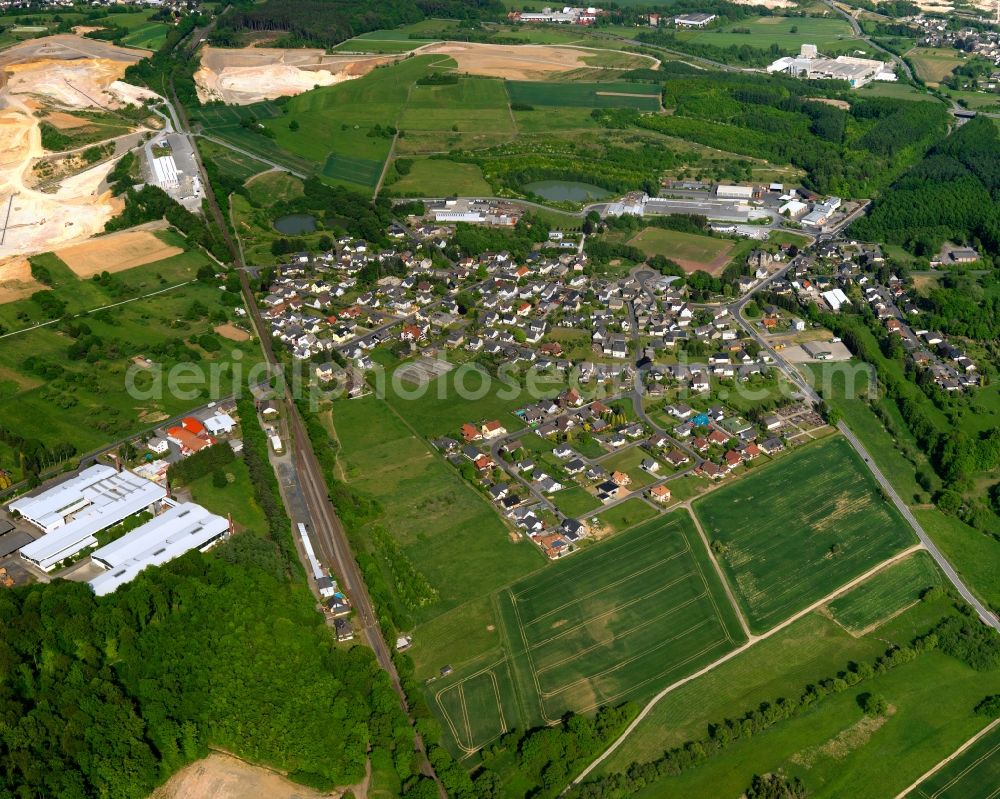 Aerial photograph Moschheim - View of Moschheim in the state of Rhineland-Palatinate. The borough and municipiality is located in the county district of Westerwaldkreis in the low mountain range of Westerwald - the so called Kannenbaeckerland. Moschheim is surrounded by agricultural land and meadows