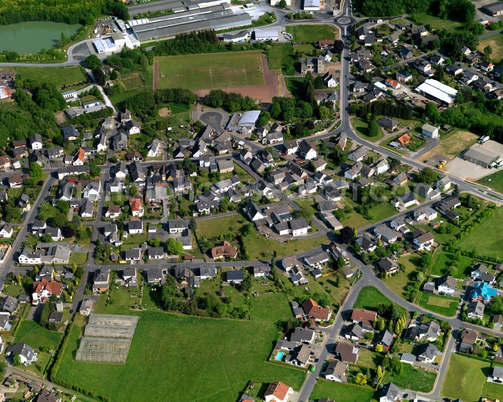 Moschheim from above - View of Moschheim in the state of Rhineland-Palatinate. The borough and municipiality is located in the county district of Westerwaldkreis in the low mountain range of Westerwald - the so called Kannenbaeckerland. Moschheim is surrounded by agricultural land and meadows