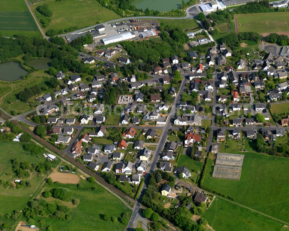 Aerial photograph Moschheim - View of Moschheim in the state of Rhineland-Palatinate. The borough and municipiality is located in the county district of Westerwaldkreis in the low mountain range of Westerwald - the so called Kannenbaeckerland. Moschheim is surrounded by agricultural land and meadows