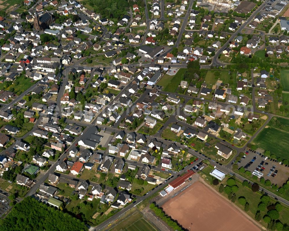 Nentershausen from above - View of Nentershausen in the state of Rhineland-Palatinate. The borough and municipiality is located in the county district of Westerwaldkreis in the South of the low mountain range of Westerwald. Nentershausen is surrounded by agricultural land, forest and meadows. It includes two hamlets. Sports facilities including a football pitch are located in the South of the centre of the village