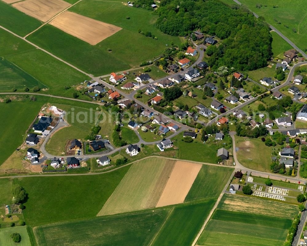 Aerial photograph Neunkirchen - View of the borough of Neunkirchen in the state of Rhineland-Palatinate. The borough is located in the county district and region of Westerwald. The residential village is surrounded by fields and meadows