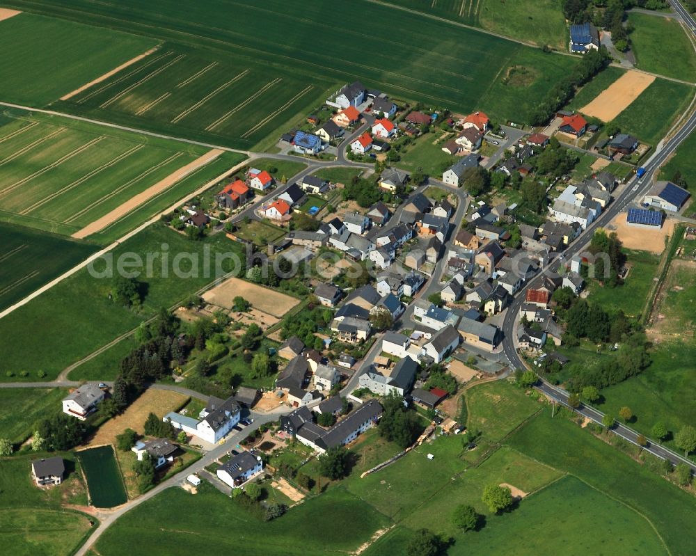 Aerial photograph Oberfischbach - View of the borough of Oberfischbach in the state of Rhineland-Palatinate. The borough and municipiality is located in the county district of Rhine-Lahn. The agricultural village consists of residential areas and is surrounded by fields and meadows