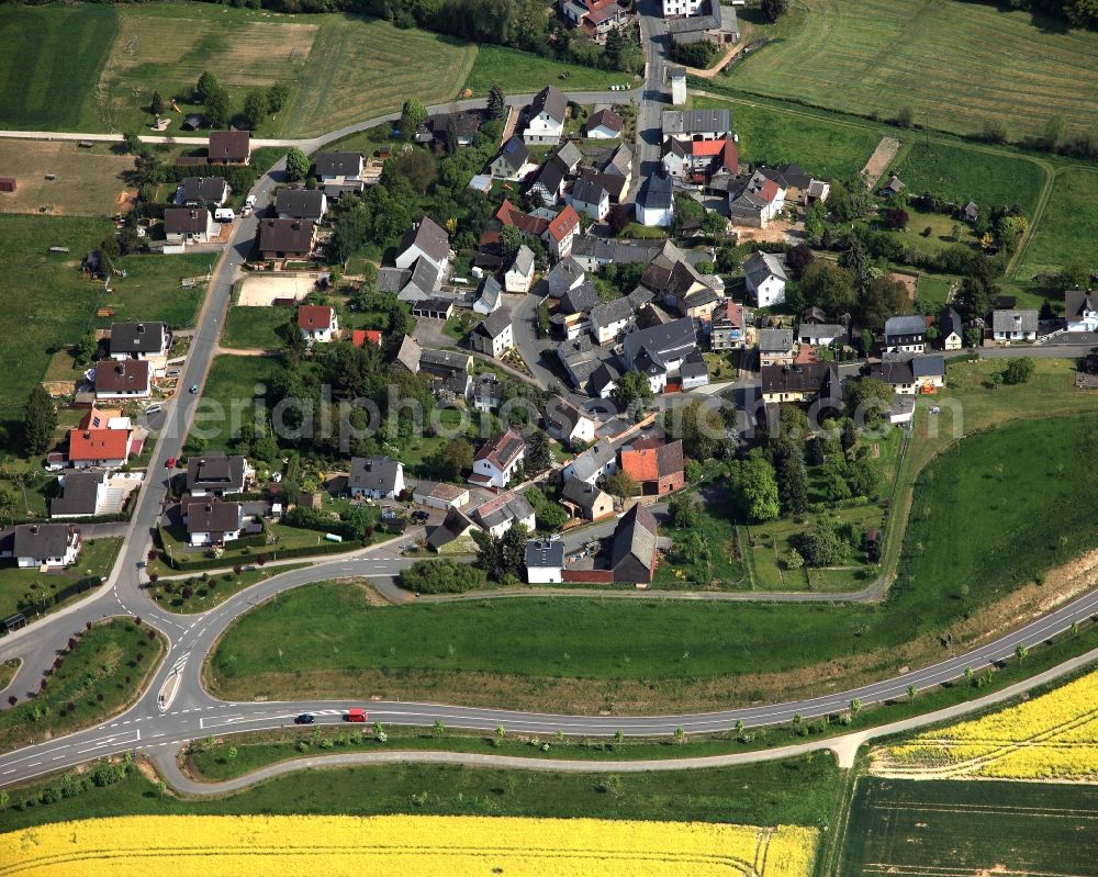 Reckenroth from above - View of the borough of Reckenroth in the state of Rhineland-Palatinate. The borough and municipiality is located in the county district of Rhine-Lahn, in the Hintertaunus mountain region. The agricultural village consists of residential areas and is surrounded by rapeseed fields and meadows
