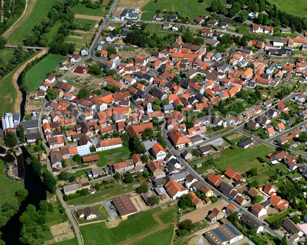 Rehborn from above - View of the borough and municipiality of Rehborn in the state of Rhineland-Palatinate. The agricultural borough is located in the county district of Bad Kreuznach. Surrounded by fields and forest, the village is located on the riverbank of the Glan river