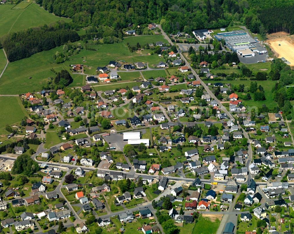 Aerial image Rehe - View of the borough of Rehe in the state of Rhineland-Palatinate. The borough is located in the county district and region of Westerwald. The residential village is surrounded by fields and meadows and sits on federal highway B255