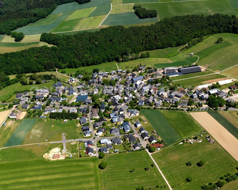 Aerial image Roth - View of the borough of Roth in the state of Rhineland-Palatinate. The borough and municipiality is located in the county district of Rhine-Hunsrueck, in the Hunsrueck region. The agricultural village consists of residential areas and is surrounded by fields and meadows. It sits on a forest on Unterbach creek