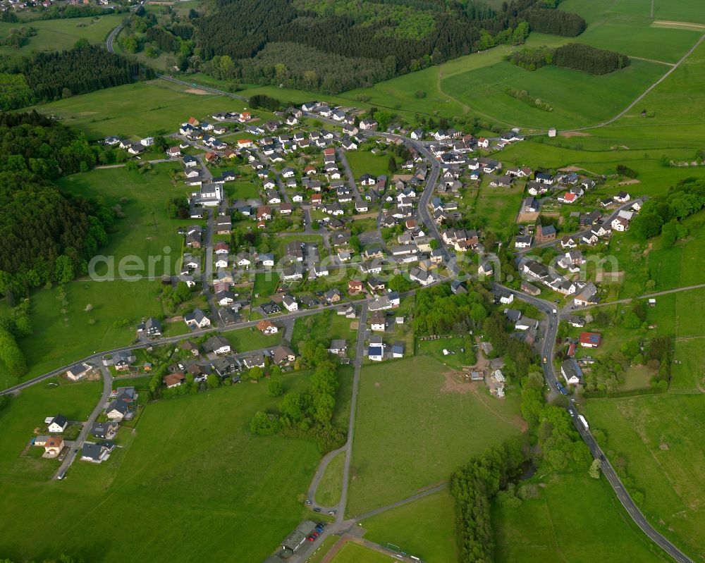 Rothenbach from above - View of Rothenbach in the state of Rhineland-Palatinate. The borough and municipiality Rothenbach is located in the county district of Westerwaldkreis and is a rural residential borough. Rothenbach is surrounded by agricultural land, hills and meadows and located on the federal highway B255