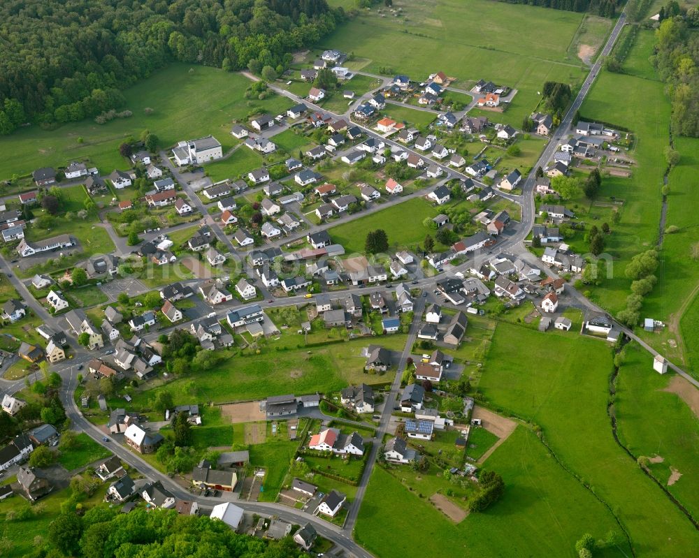 Rothenbach from the bird's eye view: View of Rothenbach in the state of Rhineland-Palatinate. The borough and municipiality Rothenbach is located in the county district of Westerwaldkreis and is a rural residential borough. Rothenbach is surrounded by agricultural land, hills and meadows and located on the federal highway B255