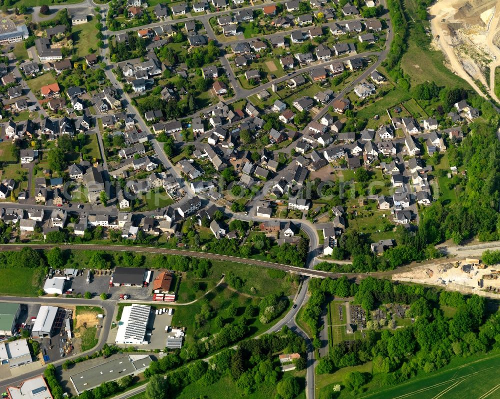 Aerial photograph Ruppach-Goldhausen - View of Ruppach-Goldhausen in the state of Rhineland-Palatinate. The borough and municipiality is located in the county district of Westerwaldkreis in the low mountain range of Westerwald in the North of the federal motorway A3. Ruppach-Goldhausen is surrounded by agricultural land, forest and meadows and located on the foot of Rupberg mountain and Ahrbach creek