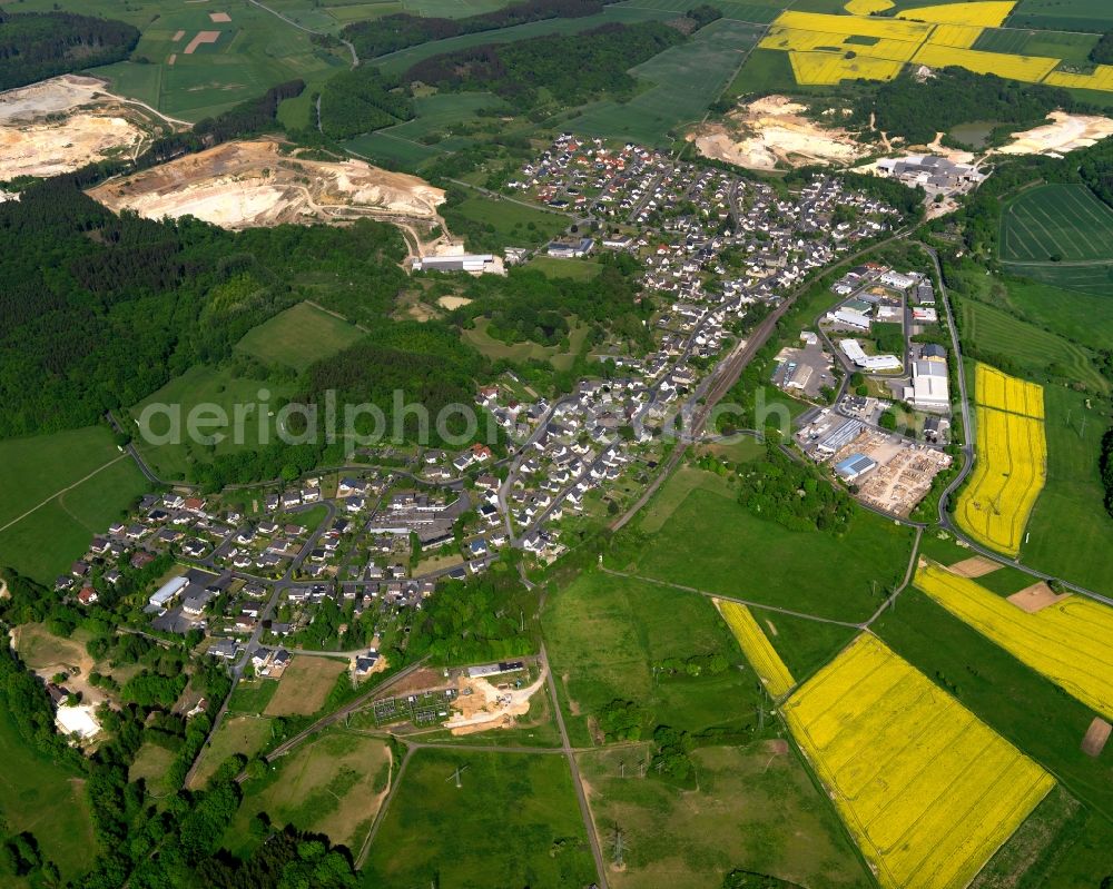 Aerial image Ruppach-Goldhausen - View of Ruppach-Goldhausen in the state of Rhineland-Palatinate. The borough and municipiality is located in the county district of Westerwaldkreis in the low mountain range of Westerwald in the North of the federal motorway A3. Ruppach-Goldhausen is surrounded by agricultural land, forest and meadows and located on the foot of Rupberg mountain and Ahrbach creek