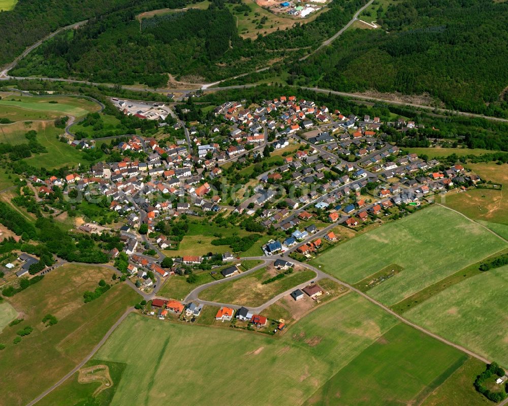 Aerial photograph Ruschberg - View of Ruschberg in the state of Rhineland-Palatinate. Ruschberg is a borough and municipiality in the county district of Birkenfeld, in the region of the Westrich, Baumholder creek. The village is surrounded by hills, fields and vineyards and consists of several hamlets and residential areas