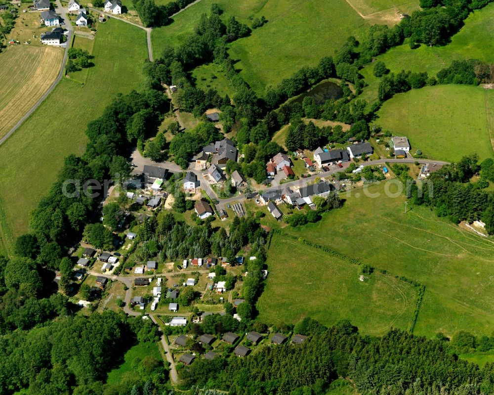 Aerial image Schauren - View of Schauren in the state of Rhineland-Palatinate. The borough and municipiality is located in the county district of Birkenfeld, at Idar Forest in the Hunsrueck region. It is surrounded by agricultural land, meadows and forest. The hamlets Aschieder Mill and Schaurener Mill belong to the borough