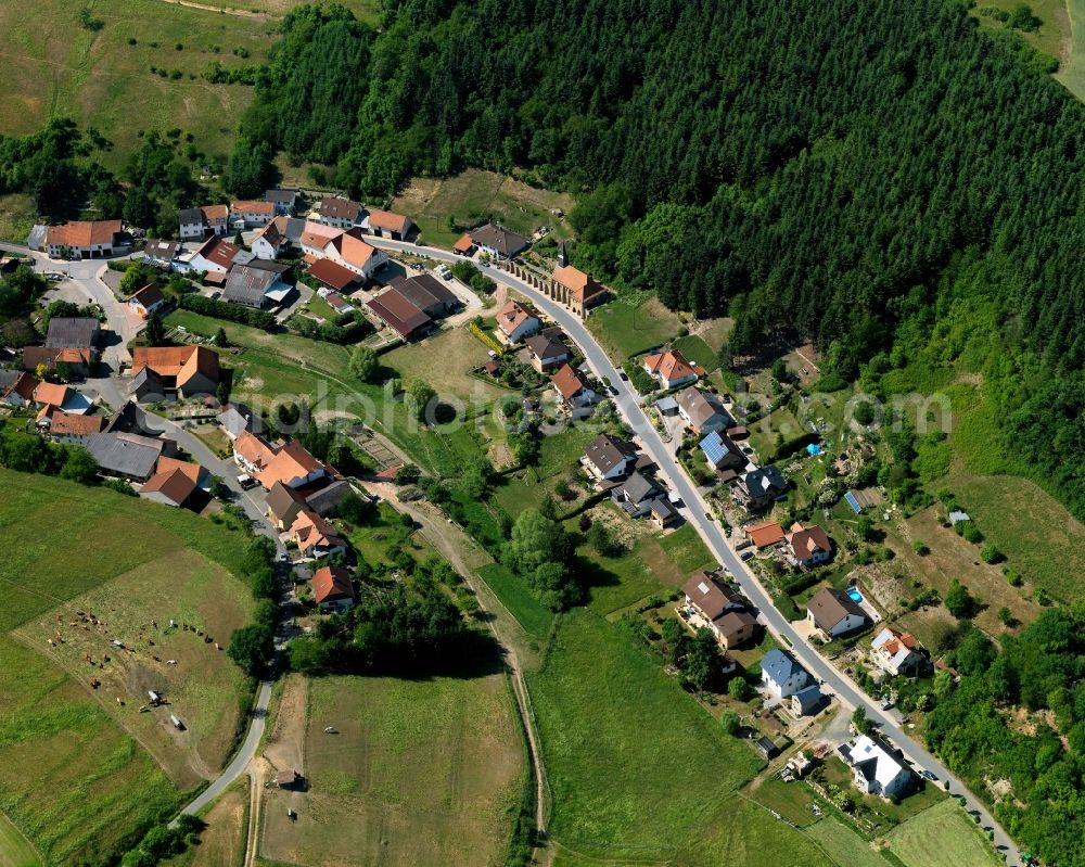 Aerial image Schmittweiler - View of the borough and municipiality of Schmittweiler in the state of Rhineland-Palatinate. The agricultural borough is located in the county district of Bad Kreuznach. Surrounded by fields, hills and forest, the village is located in the mountain range of Northern Palatinate - in the valley of the Eschelbach creek