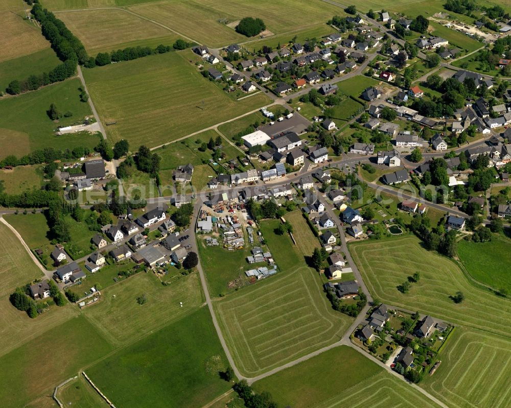 Sensweiler from the bird's eye view: View of Sensweiler in the state of Rhineland-Palatinate. The borough and municipiality is an official spa resort and located in the county district of Birkenfeld, in the Hunsrueck region in the Upper Idar Valley. It is surrounded by agricultural land, meadows and forest and includes the hamlets of Sensweiler Mills and Waldhof