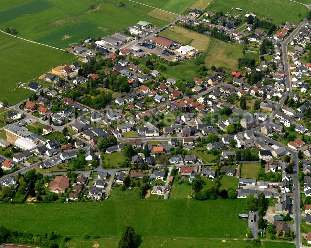 Aerial image Sessenhausen - View of the borough of Sessenhausen in the state of Rhineland-Palatinate. The borough and municipiality is located in the county district of Westerwaldkreis. The agricultural village consists of residential areas and is surrounded by rapeseed fields and meadows