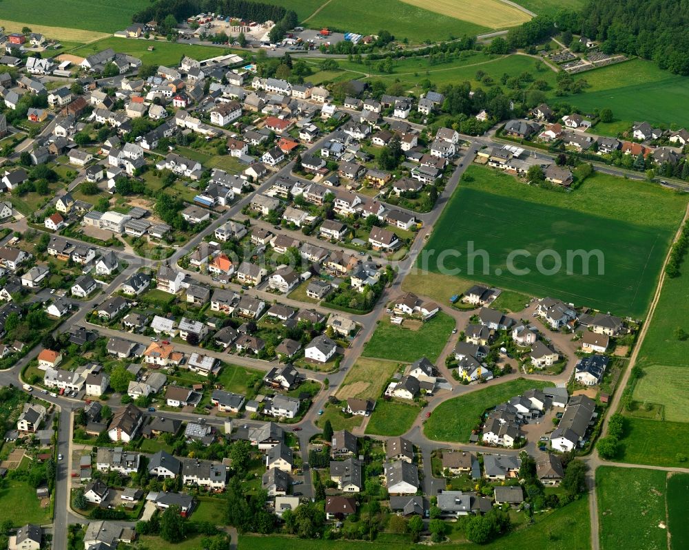 Aerial photograph Simmern - View of Simmern in the state of Rhineland-Palatinate. The borough and municipiality is located in the county district of Westerwaldkreis in the low mountain range of Westerwald at the edge of the Nature Park Nassau. Simmern is surrounded by agricultural land, hills, canola fields and meadows