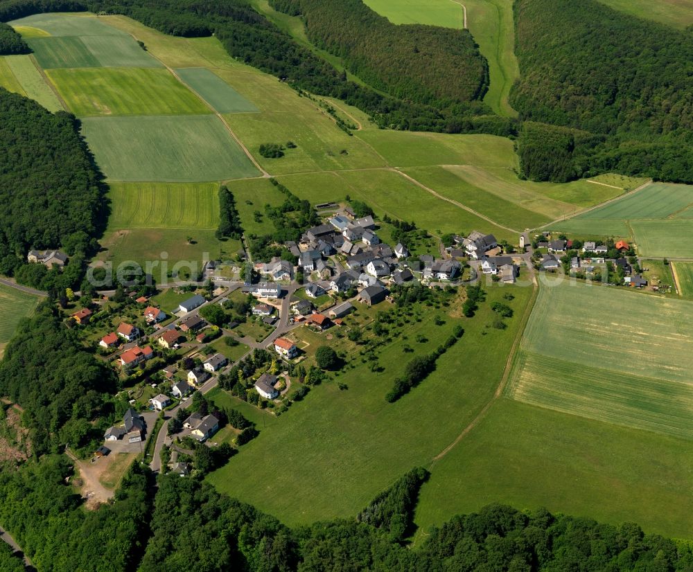 Sonnschied from above - View of Sonnschied in the state of Rhineland-Palatinate. The borough and municipiality is located in the county district of Birkenfeld, in the Hunsrueck region at Idar Forest. It is surrounded by agricultural land, meadows and forest