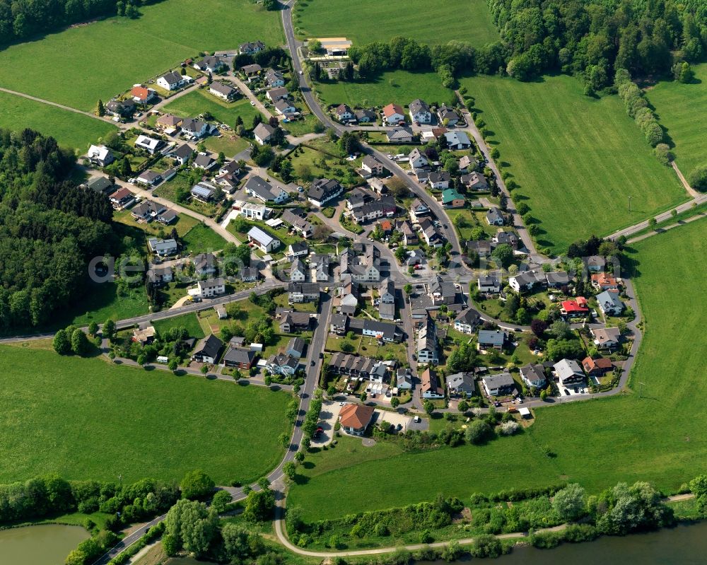 Stahlhofen am Wiesensee from the bird's eye view: View of the borough of Stahlhofen am Wiesensee in the state of Rhineland-Palatinate. The borough is located in the county district and region of Westerwald. The residential village is surrounded by fields and meadows. It is located on the Western shore of the lake