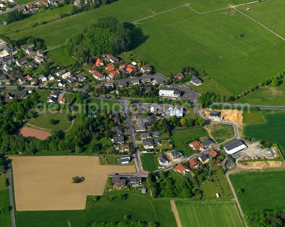 Staudt from the bird's eye view: View of Staudt in the state of Rhineland-Palatinate. The borough and municipiality is located in the county district of Westerwaldkreis in the low mountain range of Westerwald - the so called Kannenbaeckerland. Staudt is surrounded by agricultural land and meadows and located on the creeks Ahrbach and Kruemmelbach