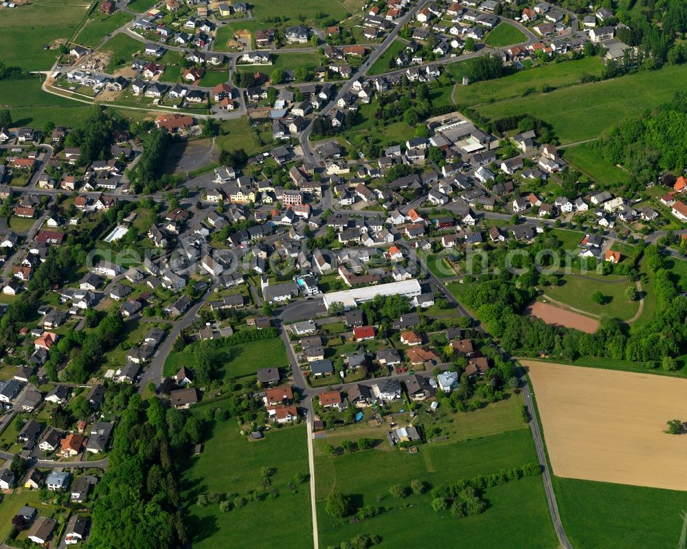 Aerial image Staudt - View of Staudt in the state of Rhineland-Palatinate. The borough and municipiality is located in the county district of Westerwaldkreis in the low mountain range of Westerwald - the so called Kannenbaeckerland. Staudt is surrounded by agricultural land and meadows and located on the creeks Ahrbach and Kruemmelbach