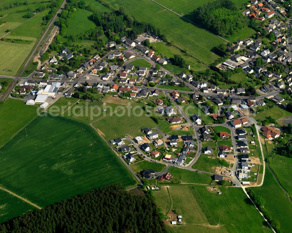 Aerial image Staudt - View of Staudt in the state of Rhineland-Palatinate. The borough and municipiality is located in the county district of Westerwaldkreis in the low mountain range of Westerwald - the so called Kannenbaeckerland. Staudt is surrounded by agricultural land and meadows and located on the creeks Ahrbach and Kruemmelbach