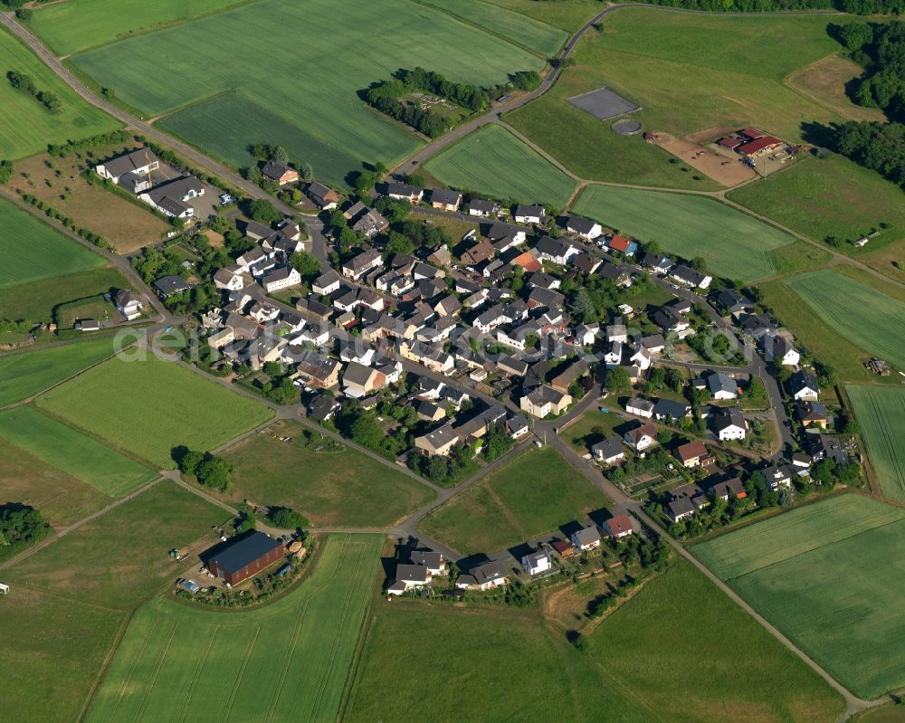 Aerial image Steinsberg - View of the borough of Steinsberg in the state of Rhineland-Palatinate. The borough and municipiality is located in the county district of Rhine-Lahn. The agricultural village consists of residential buildings and areas, sits in the Western Taunus mountain range and is surrounded by meadows and fields