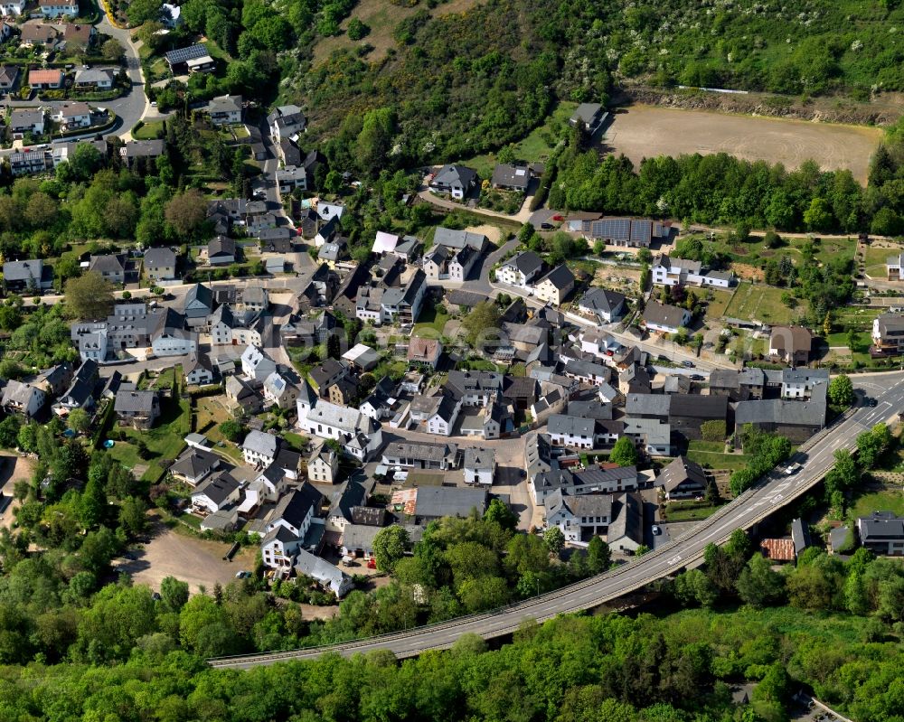 Trimbs from above - View of Trimbs in the state of Rhineland-Palatinate. The agricultural borough and municipiality is located in the county district of Mayen-Koblenz, above the Valley of the river Nette and on the road L113, and is surrounded by meadows and rapeseed fields