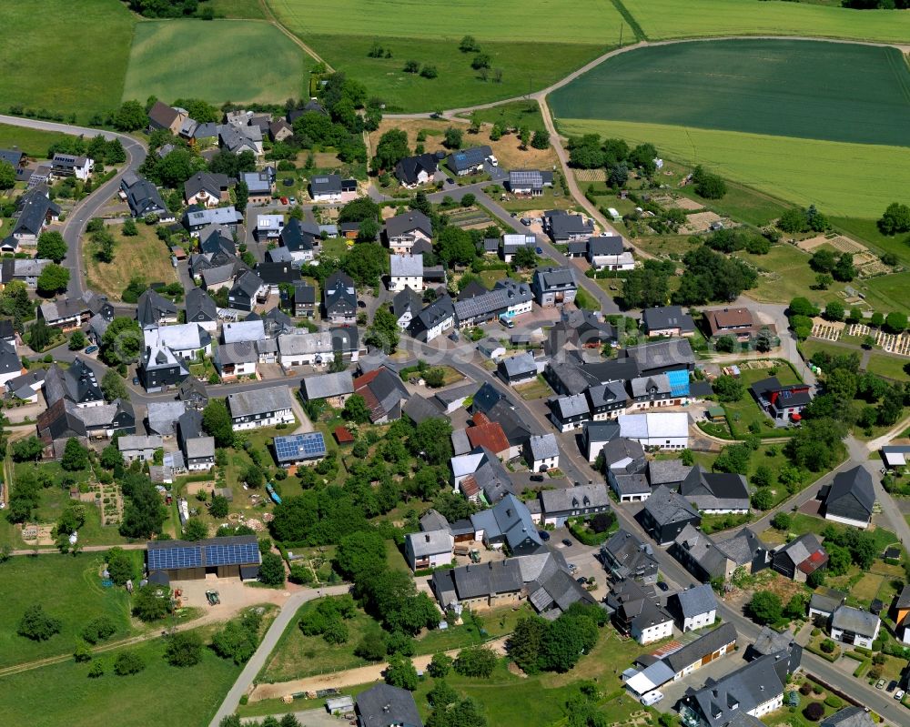 Uhler from the bird's eye view: View of the borough of Uhler in the state of Rhineland-Palatinate. The borough and municipiality is located in the county district of Rhine-Hunsrueck, in the Hunsrueck region. The agricultural village consists of residential areas and is surrounded by fields and meadows