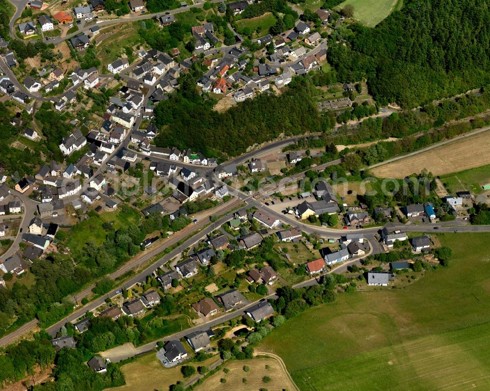 Aerial image Urmersbach - View of Urmersbach in the state of Rhineland-Palatinate. The borough and municipiality is located in the county district of Cochem-Zell in the Eastern Eifel Region. Obermuehle and Schuwackerhof are hamlets of Hauroth. It is surrounded by agricultural land, meadows and forest