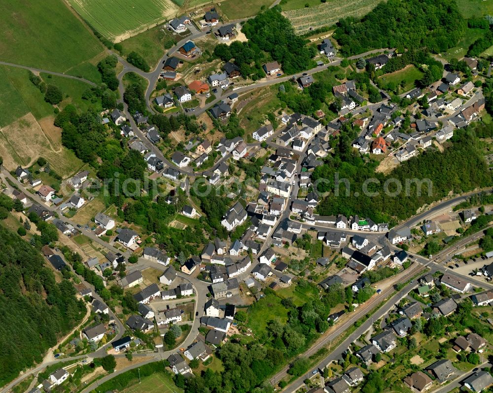 Aerial photograph Urmersbach - View of Urmersbach in the state of Rhineland-Palatinate. The borough and municipiality is located in the county district of Cochem-Zell in the Eastern Eifel Region. Obermuehle and Schuwackerhof are hamlets of Hauroth. It is surrounded by agricultural land, meadows and forest