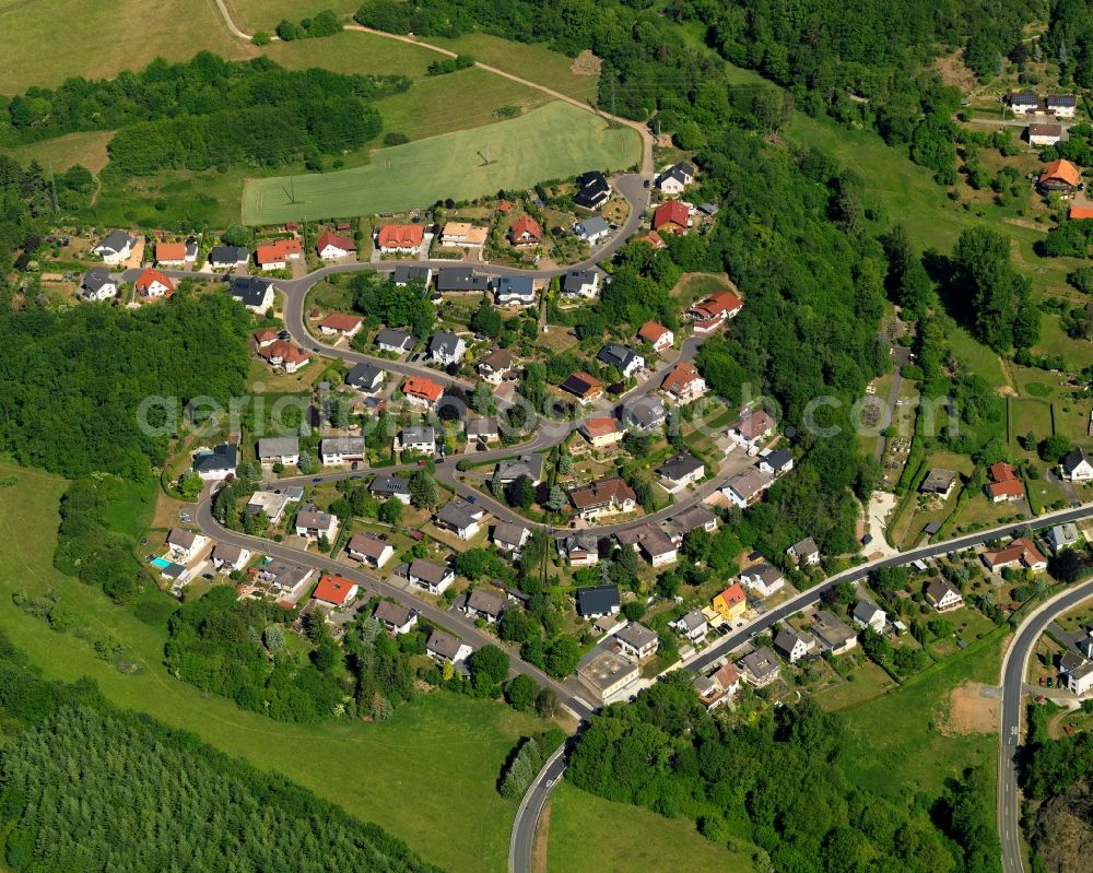 Vollmersbach from above - View of Vollmersbach in the state of Rhineland-Palatinate. The borough and municipiality is located in the county district of Birkenfeld, in the protected landscape of Hochwald-Idarwald. It is surrounded by agricultural land, meadows and forest and consists of several hamlets and residential areas