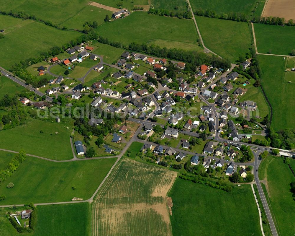 Aerial photograph Waldmühlen - View of the borough of Waldmuehlen in the state of Rhineland-Palatinate. The borough is located in the county district and region of Westerwald. The residential village is surrounded by fields and meadows, consits of single family houses and is located on federal highway B 54