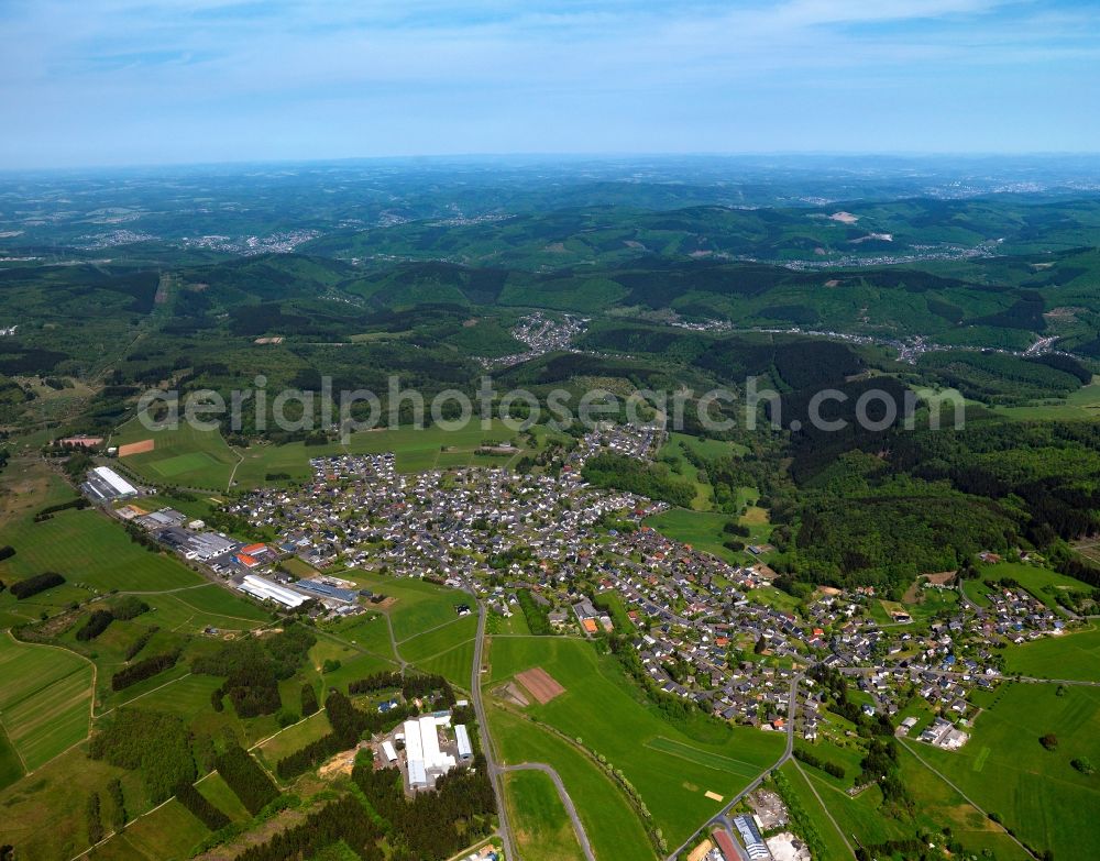 Aerial photograph Weitefeld - View of Weitefeld in the state of Rhineland-Palatinate. The borough and municipiality Weitefeld is located in the county district of Altenkirchen in the Westerwald forest region and surrounded by fields, meadows and forest. It sits on a hill